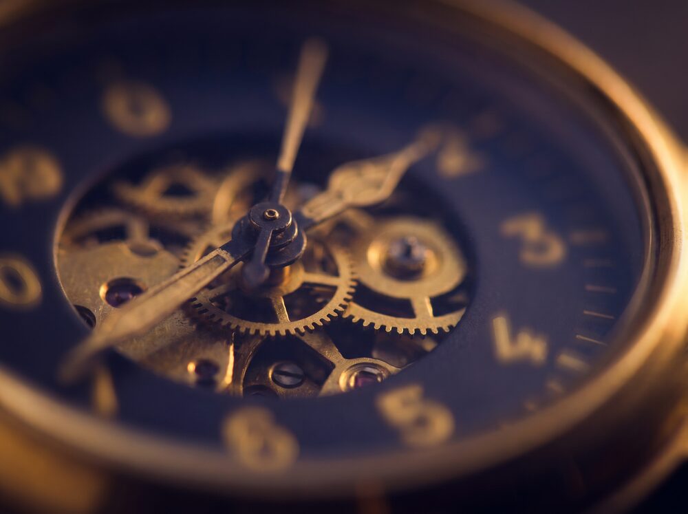 Close-up of a brass aircraft instrument dial, evoking precision and careful attention to detail